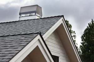 Roof eaves with fascia trim and chimney