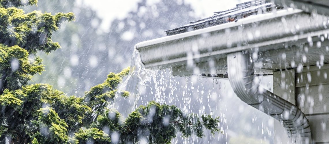 Torrential Summer Rain Storm Water Overflowing Roof Gutters